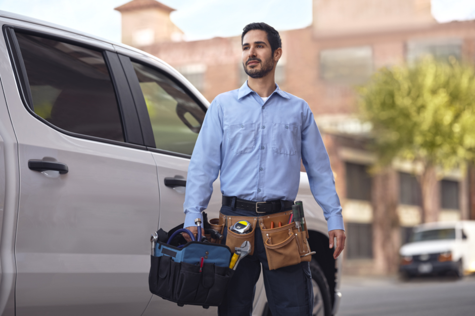 A Chevrolet electrician making installations to a Chevrolet EV.