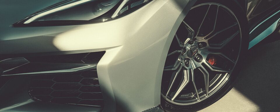 Striking exterior of the 2023 Corvette Z06 featuring the headlamps and wheel.