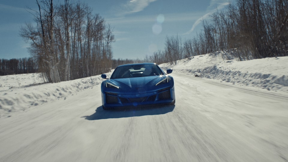 Video thumbnail of the 2024 Chevrolet Corvette E-Ray driving on a snowy road.