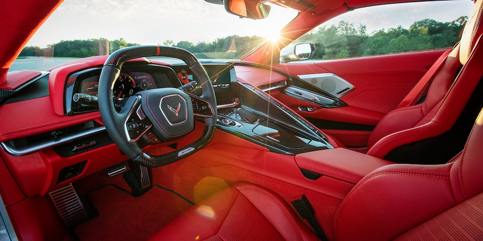The red & black jet-inspired cockpit of the Corvette Z06.