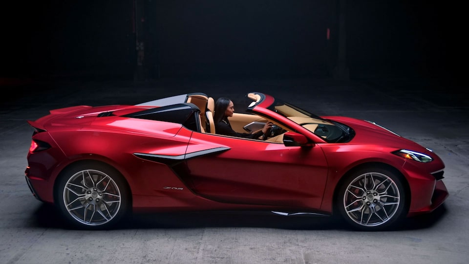 Side-view of a person riding the Chevrolet Corvette Z06.