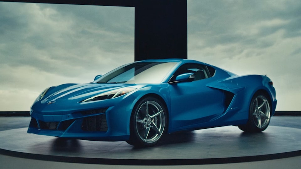 A Blue Chevrolet Corvette E-Ray Placed on a Platform for Showcase.