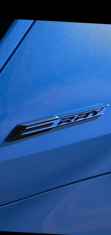 Close-up of the Chevrolet Corvette E-Ray Emblem in a Vertical Frame.