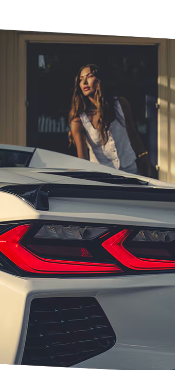 Close-Up of Rear Tail Light on the 2026 Chevy Corvette Stingray with a Woman in the Background