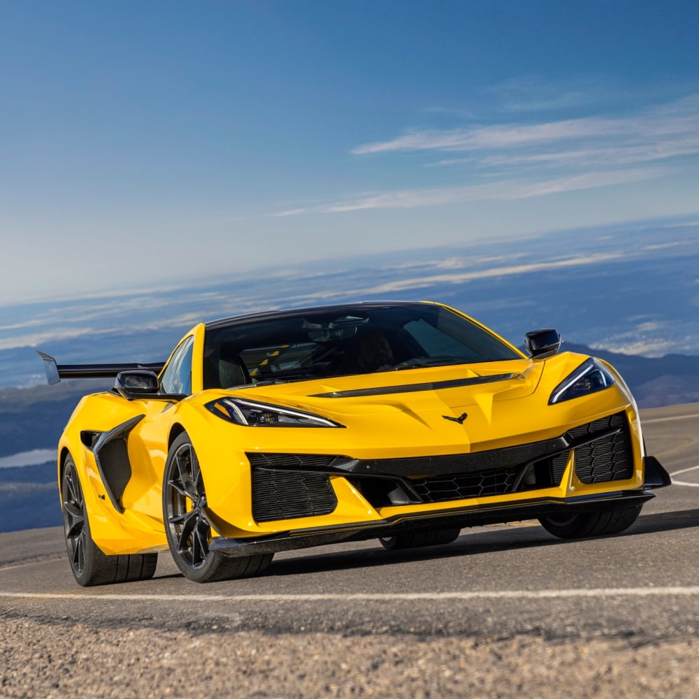 2026 Chevrolet Corvette ZR1 Driving Up a Curving Hill Road.