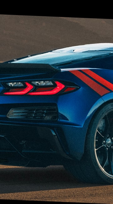Close-up view of the 2027 Chevrolet Corvette Grand Sport Rear End with the Tail Lights On.