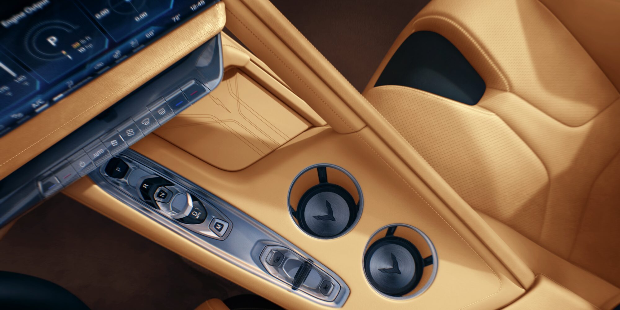 Gros plan sur l'intérieur d'une Chevrolet Corvette Z06 2027, mettant en valeur une console centrale en cuir beige et un double porte-gobelet.