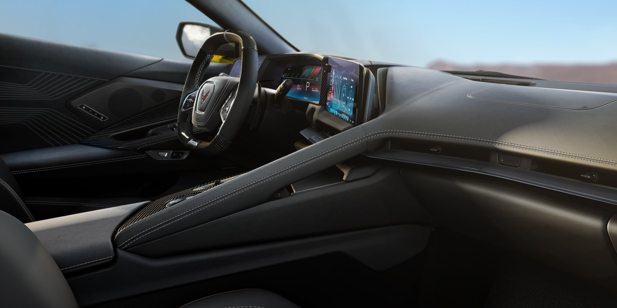 Habitacle de la Chevrolet Corvette Z06 2027 en Suède supréme, noir jais avec teinte standard Gris ciel frais