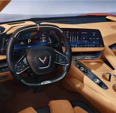 L'habitacle de la Chevrolet Corvette Z06 2027, avec son volant à méplat, son écran d'infodivertissement et sa console centrale.