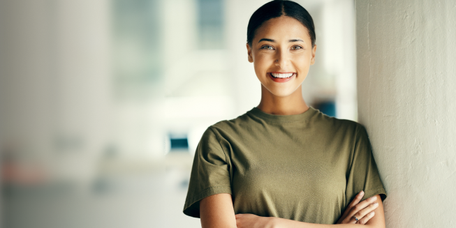 A smiling Canadian Forces personnel eligible for Chevrolet's Canadian Forces Bonus Program.