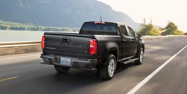 Rear View of the 2022 Chevrolet Colorado Driving On The Road.