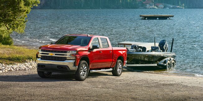 2022 Chevrolet Silverado 1500 LTD Pickup Truck Towing Boat out of Water.