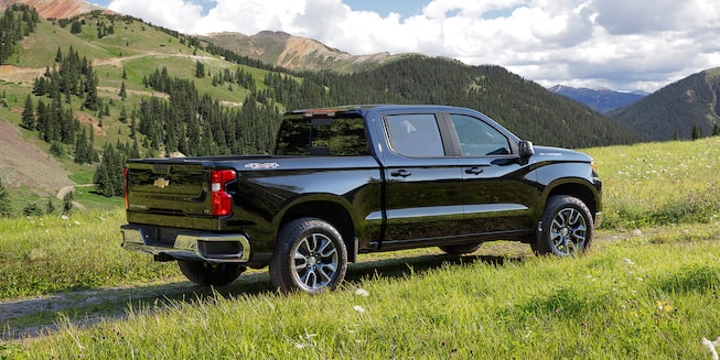 The New 2022 Chevrolet Silverado 1500 parked outdoors: back profile view.