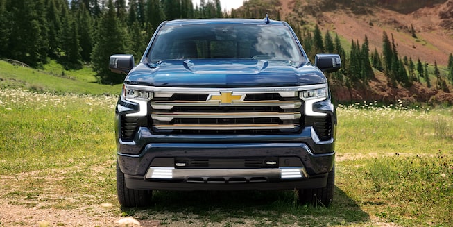 The New 2022 Silverado 1500 parked outdoors: front profile view.