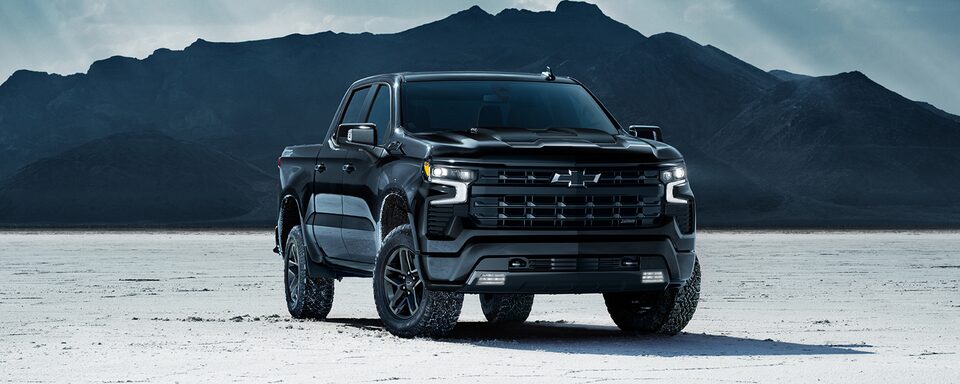 2022 Chevrolet Silverado LT Trail Boss Midnight Edition by the mountains.