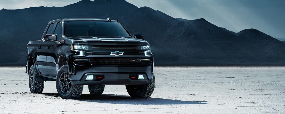 2023 Chevrolet Silverado LT Trail Boss Midnight Edition by the mountains.