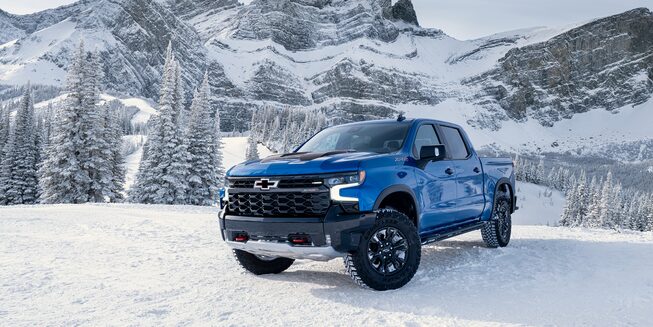 Front profile view of the 2023 Silverado ZR2 on snowy terrain.