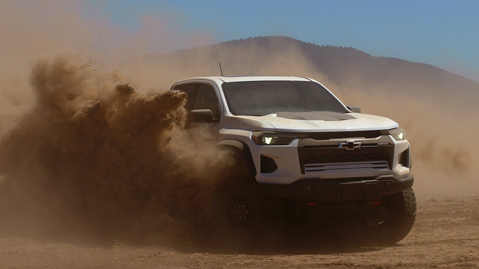 The All-New 2024 Colorado ZR2 Bison as it goes off-road and easily through dirt.