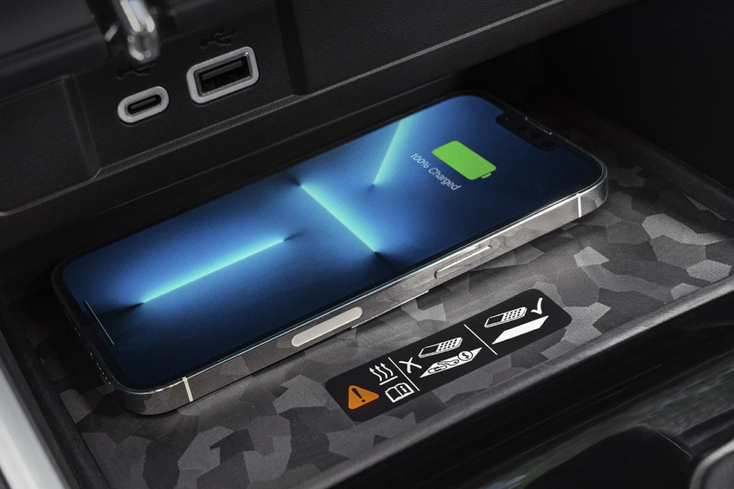 Close-up of a Smartphone Placed on Top of a Charging Station Next to the Driver's Seat of a 2026 Chevrolet Colorado.