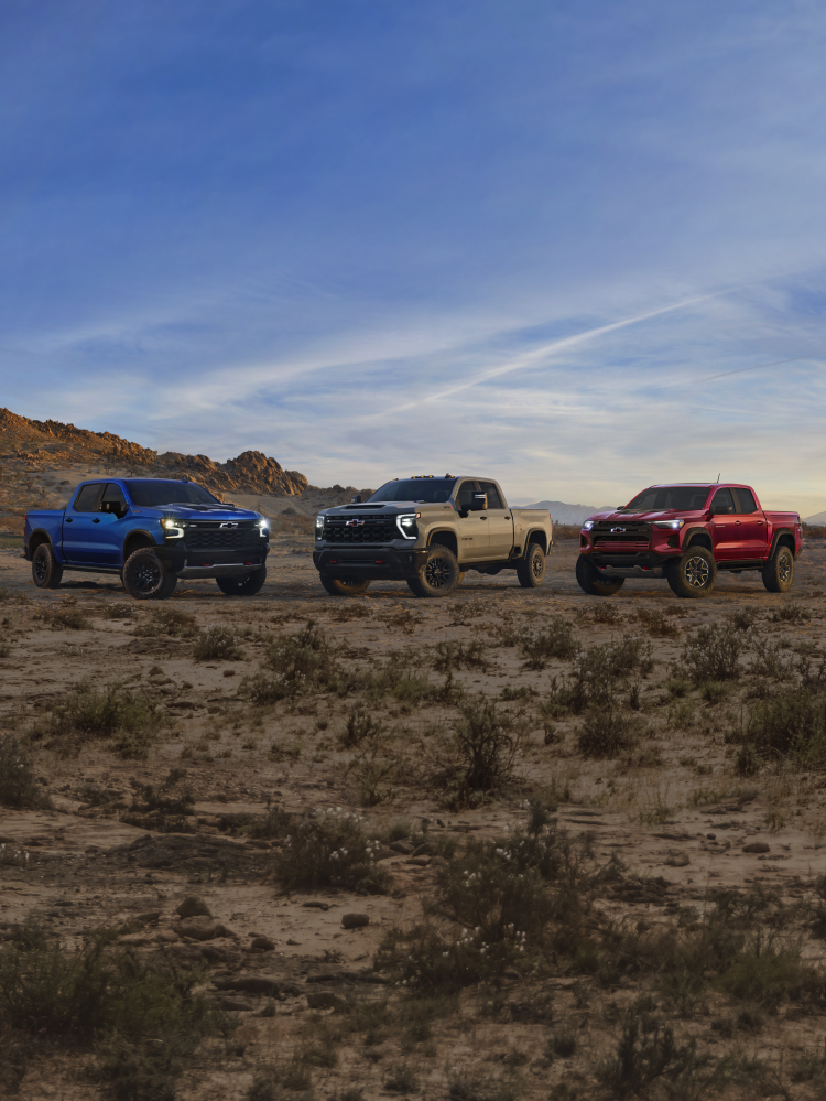 Chevrolet ZR2 Trucks Driving Up a Mountain.