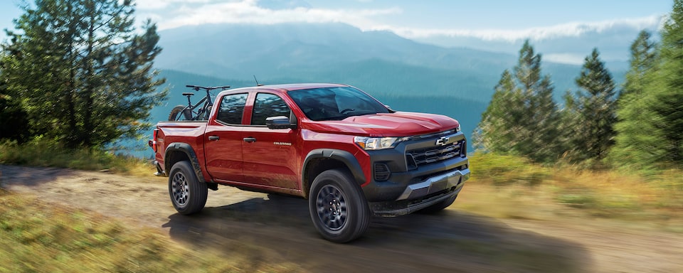 The 2023 Chevrolet Colorado Parked Along Side the Mountain Side in the Woods.