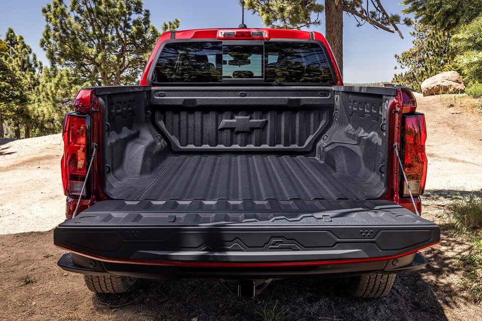 Exterior rear view of the 2023 Colorado with tailgate down.