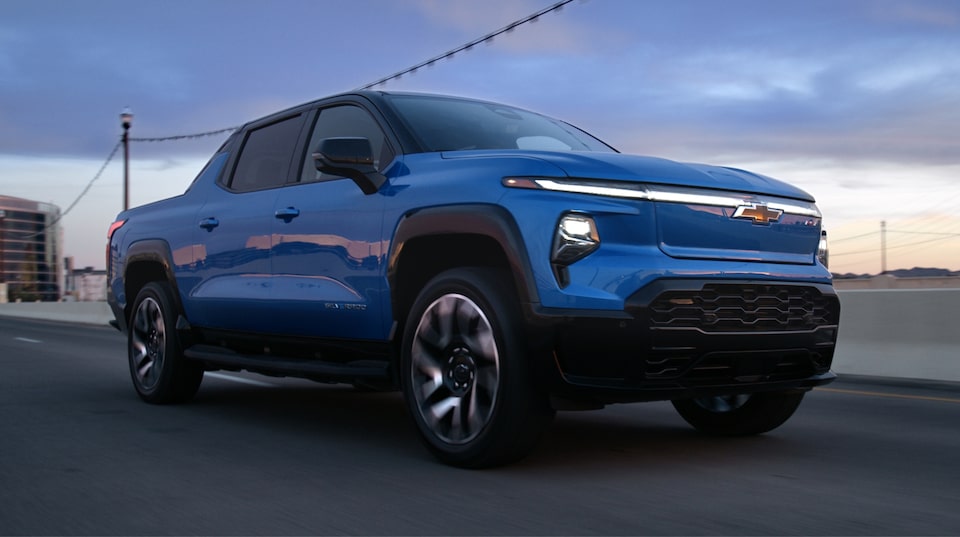 2024 Chevrolet Silverado EV driving in the city.