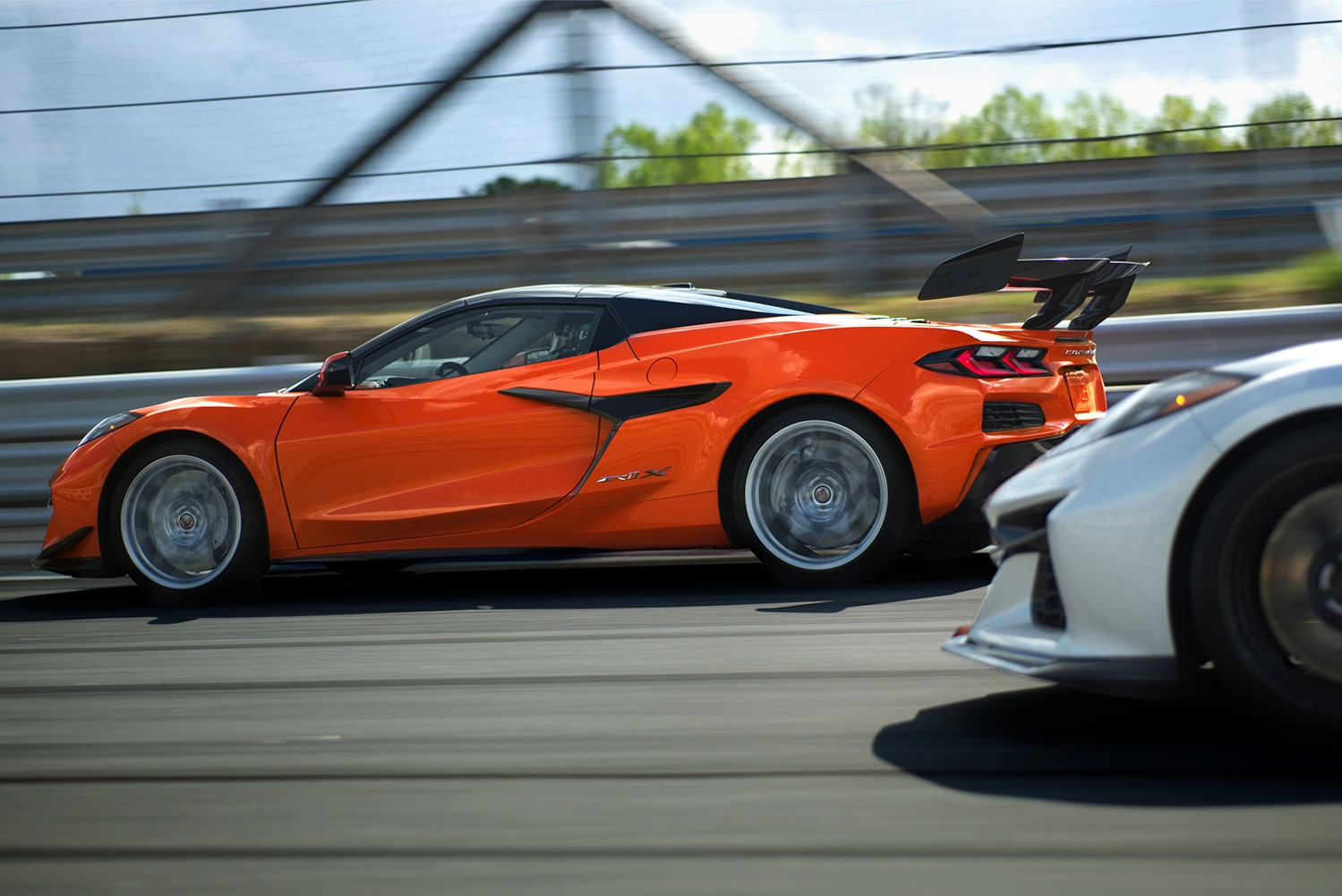 Two 2026 Chevrolet Corvette ZR1Xs driving outdoors.