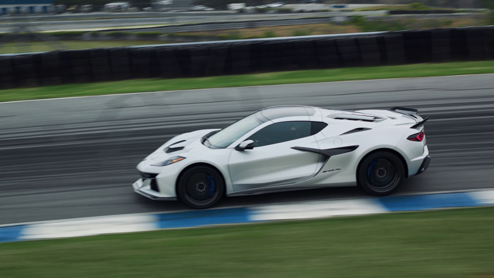 2026 Chevrolet Corvette ZR1X driving fast on the road.