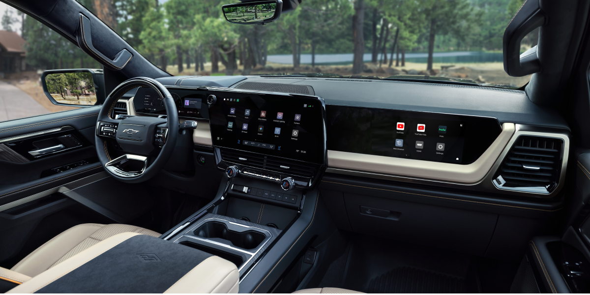 2027 Chevrolet Silverado 1500 High Country front cabin with light-coloured seating, digital displays and centre console