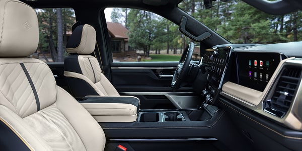 2027 Chevrolet Silverado 1500 High Country front seats and centre console with light-coloured upholstery