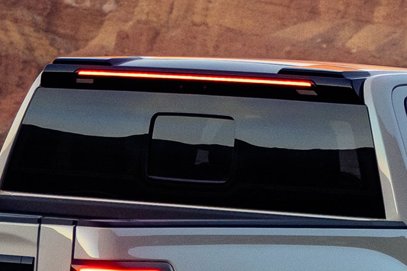Close-up of the rear window and upper brake light on a 2027 Chevrolet Silverado 1500