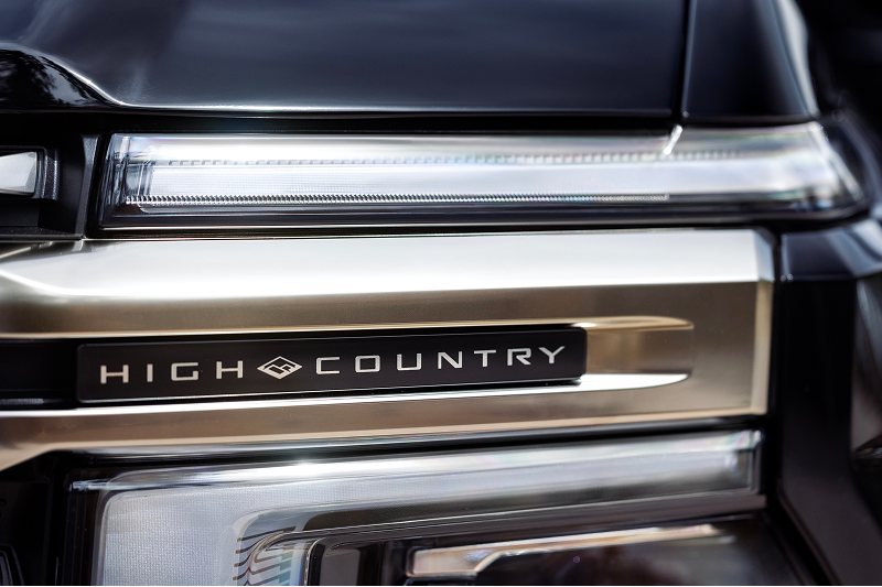 Close-up of High Country badging and exterior lighting on a 2027 Chevrolet Silverado 1500