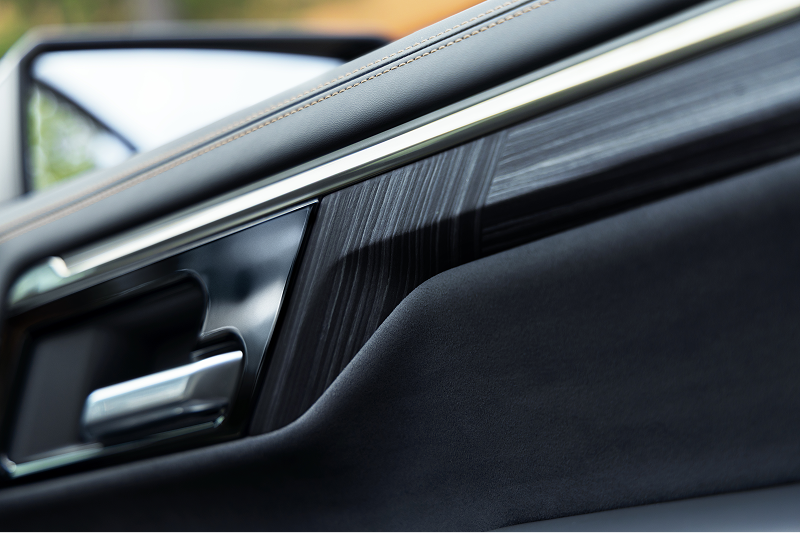Premium interior door trim and metallic door handle in a 2027 Chevrolet Silverado 1500 High Country