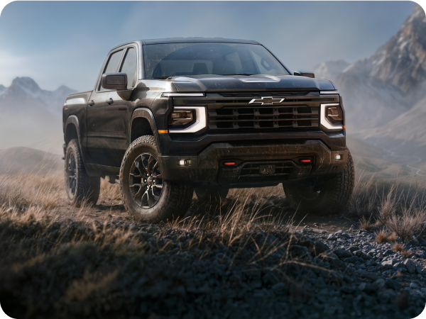 Black 2027 Chevrolet Silverado 1500 Custom Trail Boss in a mountainous landscape