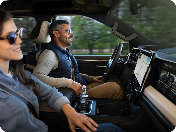 Driver and passenger in a 2027 Chevrolet Silverado 1500 equipped with available Super Cruise