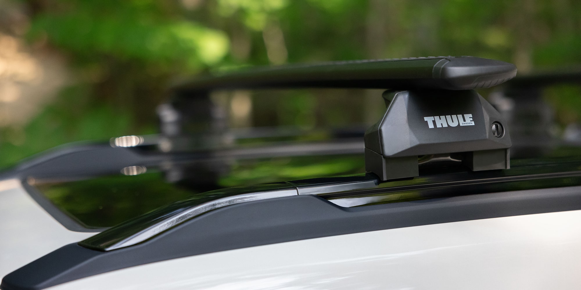 Close-up of a roof rack cross rail mounted on a 2027 Chevrolet Trailblazer SUV.