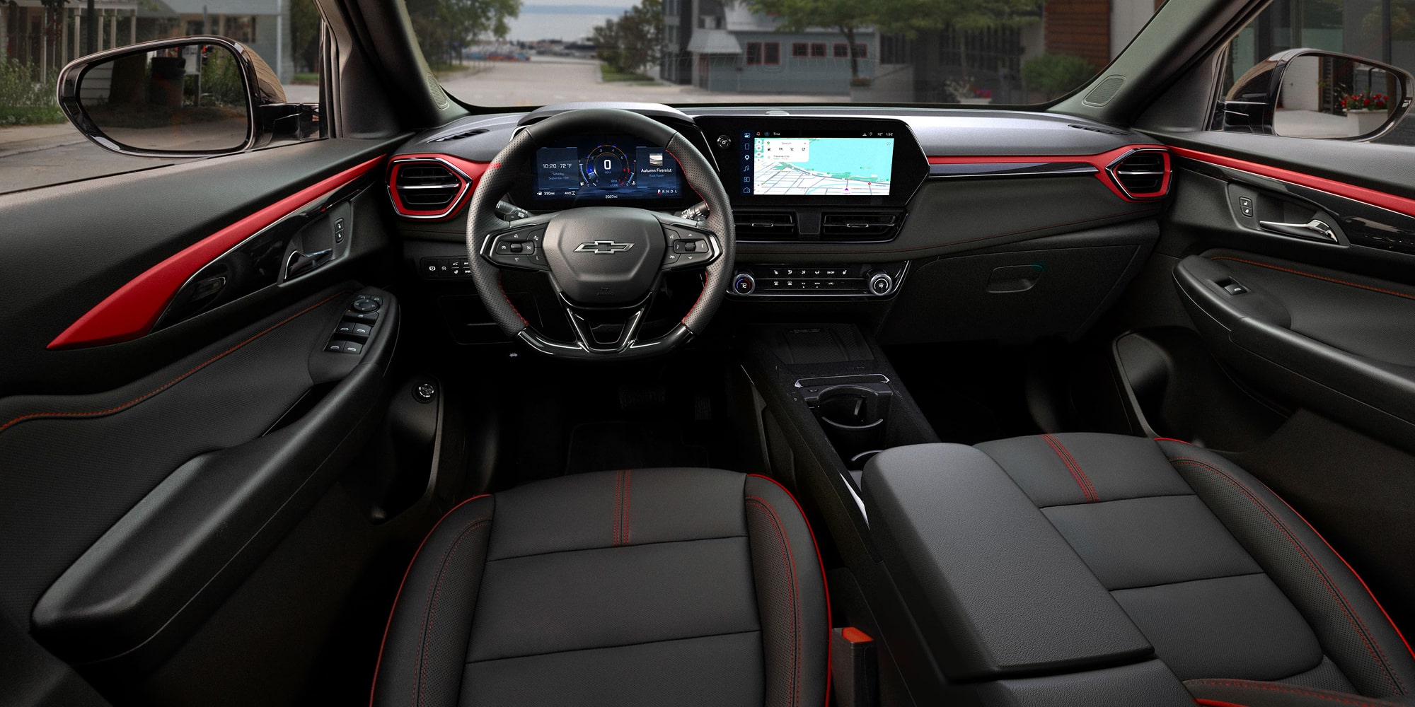 Wide view of the 2027 Chevrolet Trailblazer interior featuring black leather-appointed seats with red accent stitching.