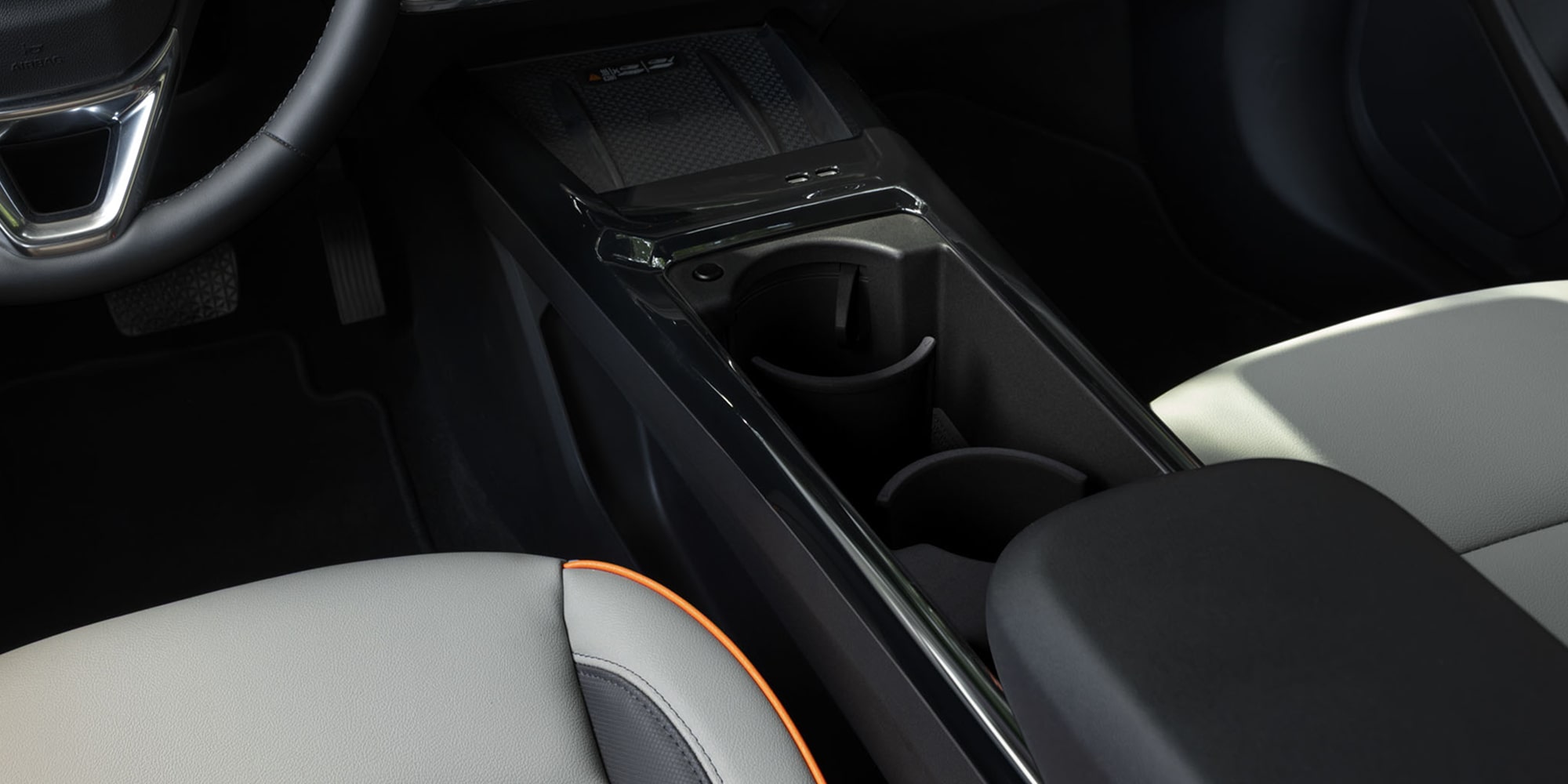 Close-up of the 2027 Chevrolet Trailblazer center console featuring dual cupholders.