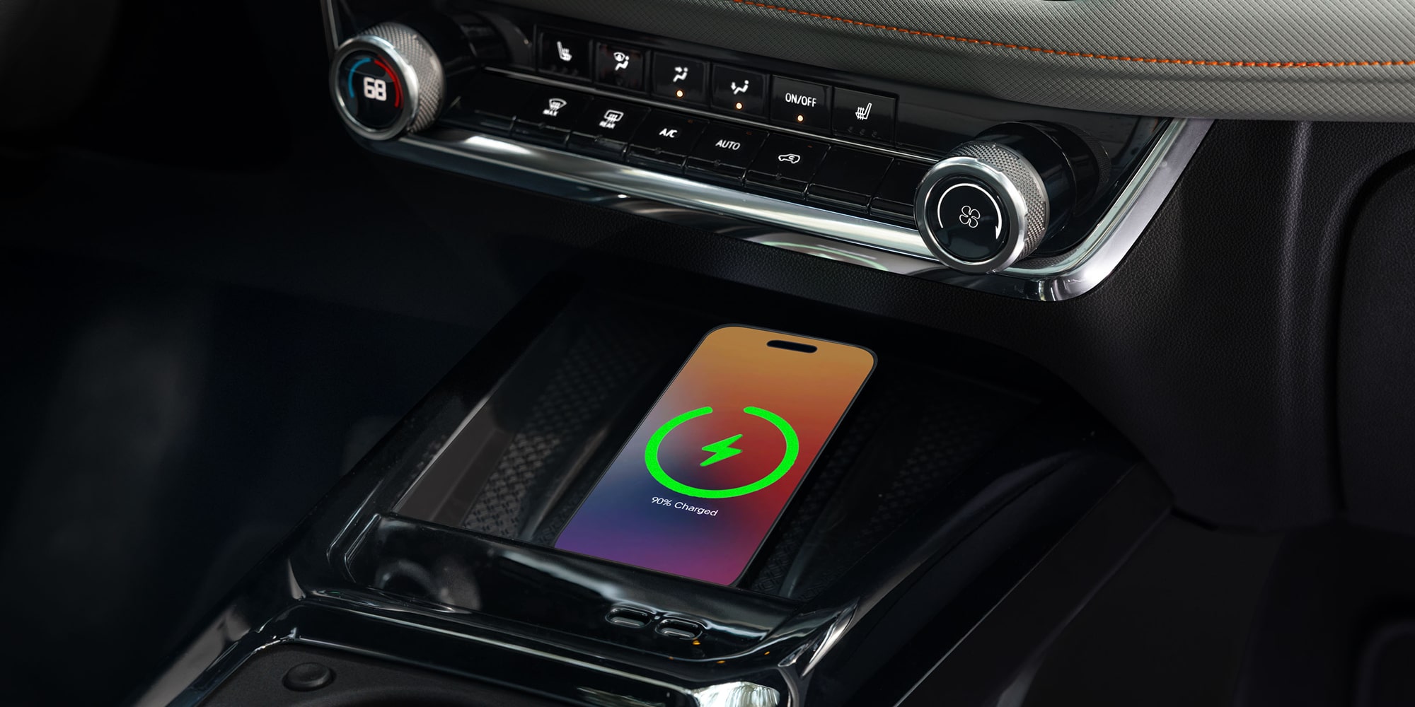 Close-up of a smartphone wirelessly charging on the 2027 Chevrolet Trailblazer’s available charging pad.