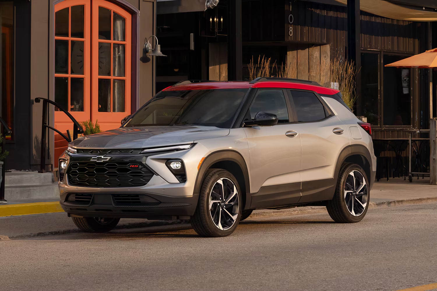 Front three-quarter view of a silver 2027 Chevrolet Trailblazer parked on a city street.