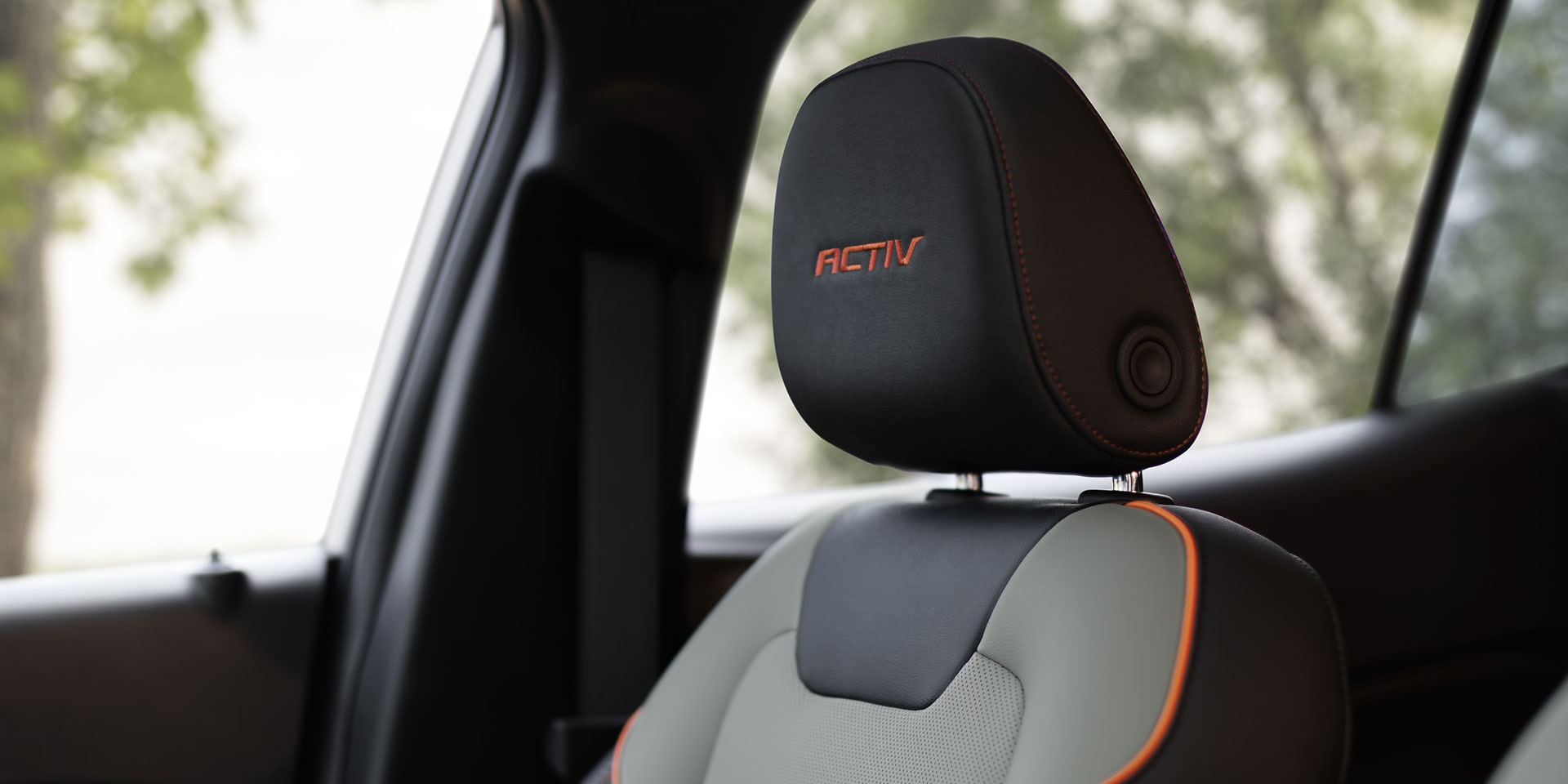 2027 Chevrolet Trax small SUV ACTIV front seat with contrast stitching, embroidered ACTIV branding, and premium interior upholstery details.