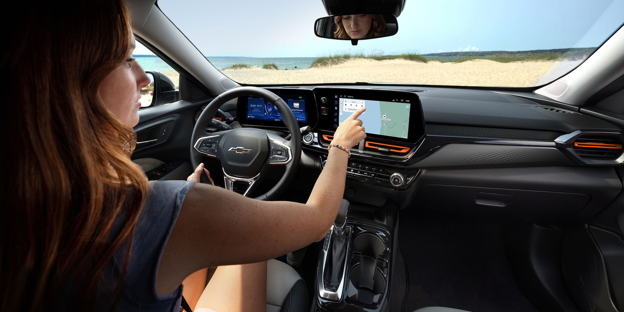 2027 Chevrolet Trax small SUV interior featuring a driver-focused cockpit, digital instrument cluster, touchscreen infotainment system, and premium seating.