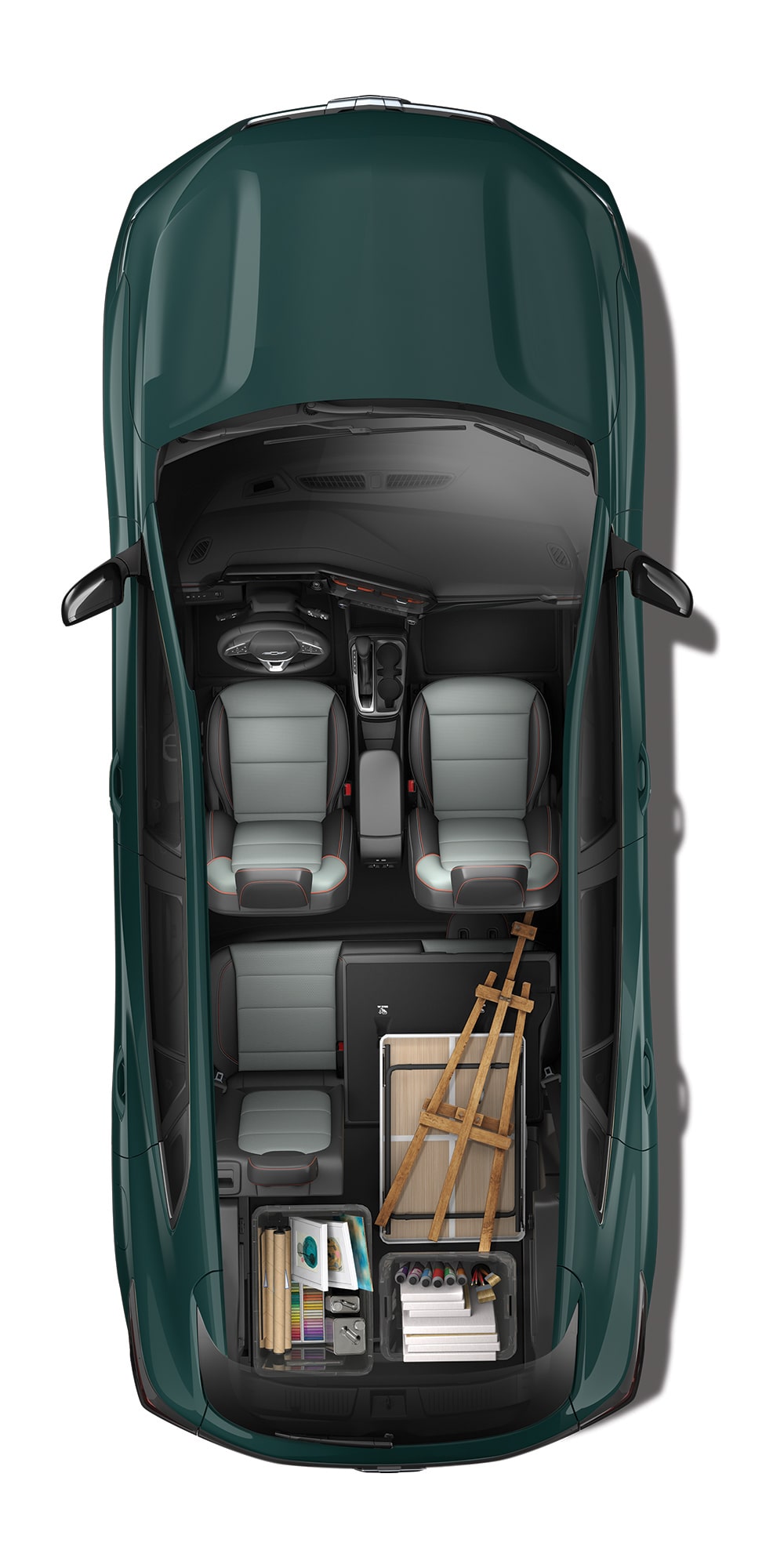 Top-down interior view of the 2027 Chevrolet Trax small SUV with the rear seats folded flat, loaded with art supplies, storage containers, and a folding easel to demonstrate cargo space and hauling versatility.