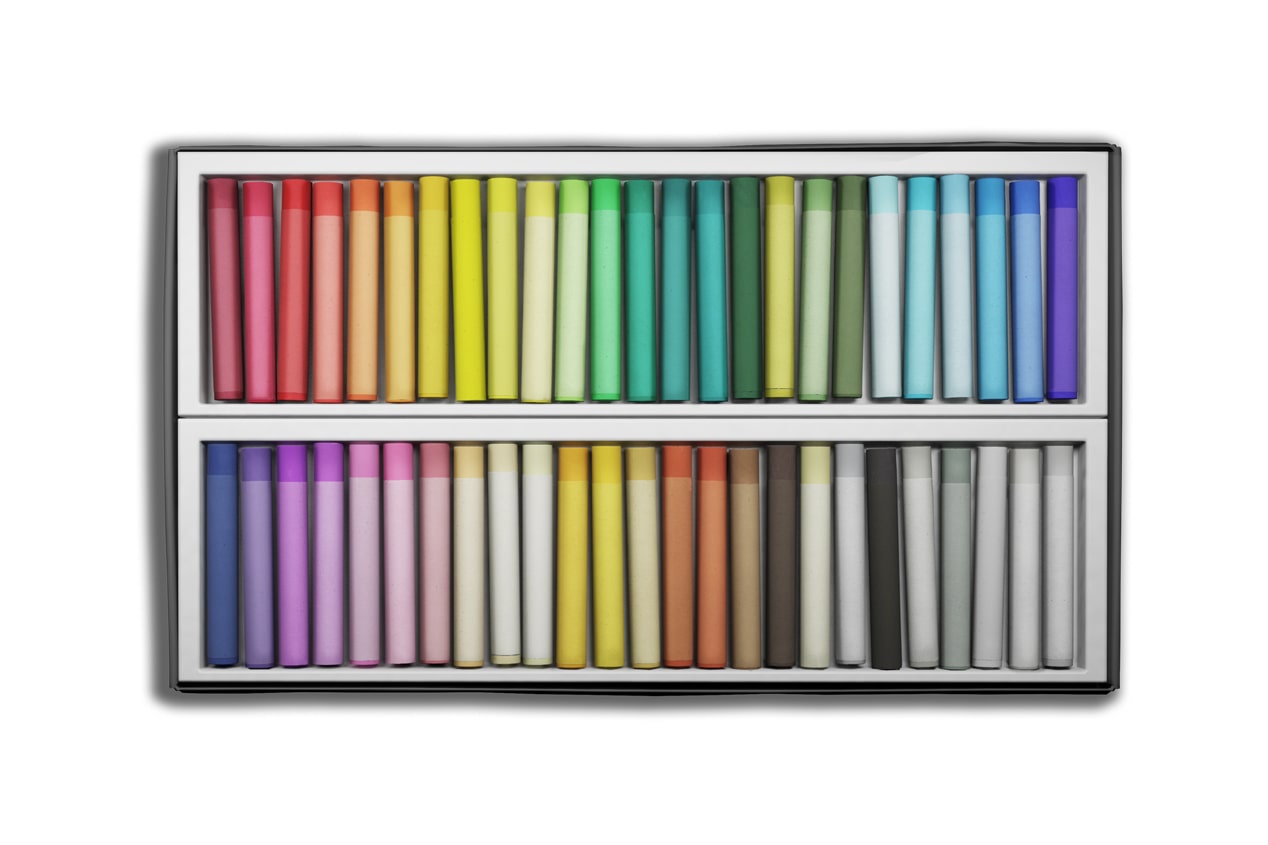 Box of colorful pastel sticks shown as an art supply item that can be transported in the cargo area of the 2027 Chevrolet Trax small SUV, highlighting cargo versatility and storage capability.