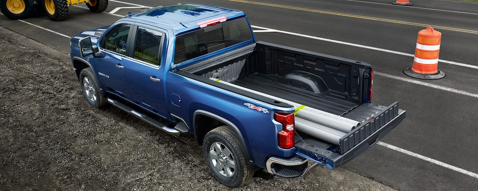 The Multi-Flex Tailgate in use by a parked 2023 Chevrolet Silverado HD.