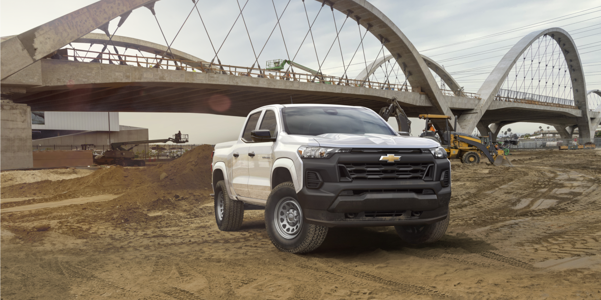 A 2026 Chevrolet Colorado Work Truck parked near a construction site.