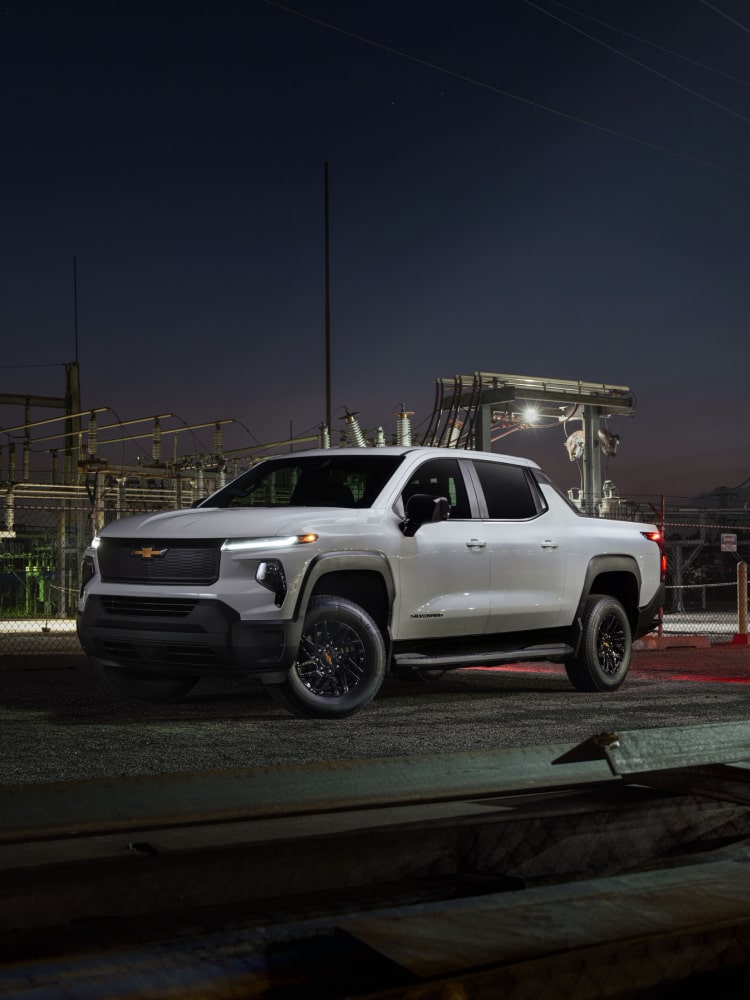 2026 Chevrolet Silverado EV Work Truck Parked at a Construction Site at Night.