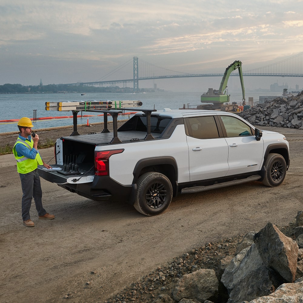 A Construction Worker Loading Equipment into the 2026 Chevrolet Silverado EV Work Truck.