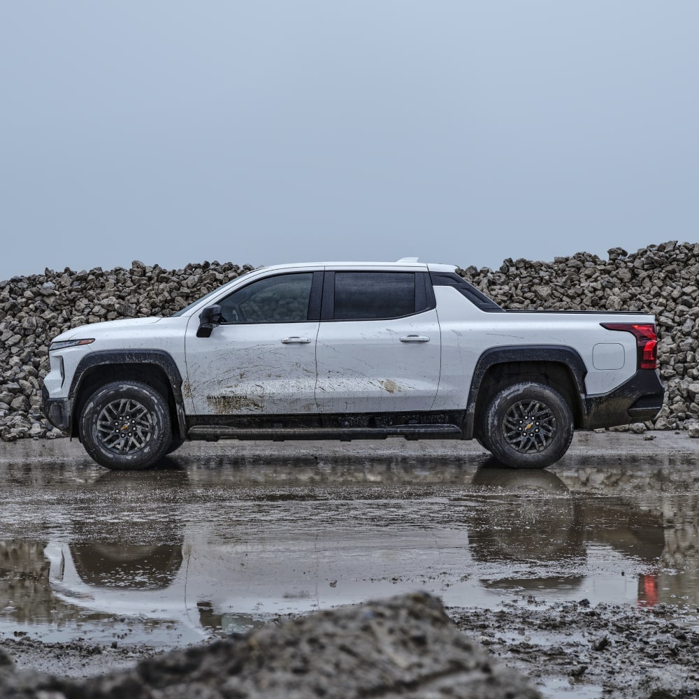 2026 Chevrolet Silverado EV Work Truck Parked on a Construction Site on a Rainy Day.